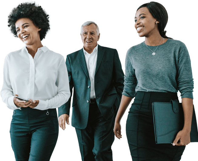 Three people in business attire walk and smile