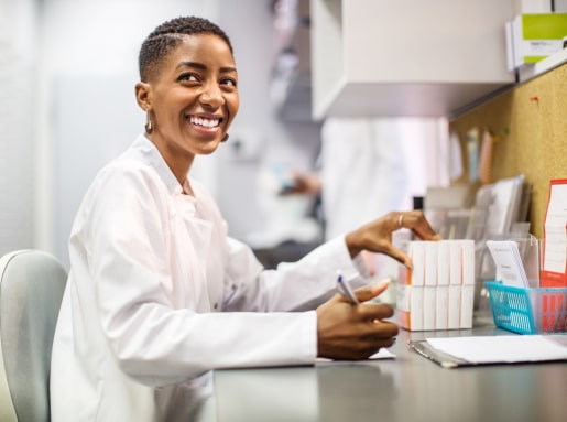 Pharmacist working, smiling