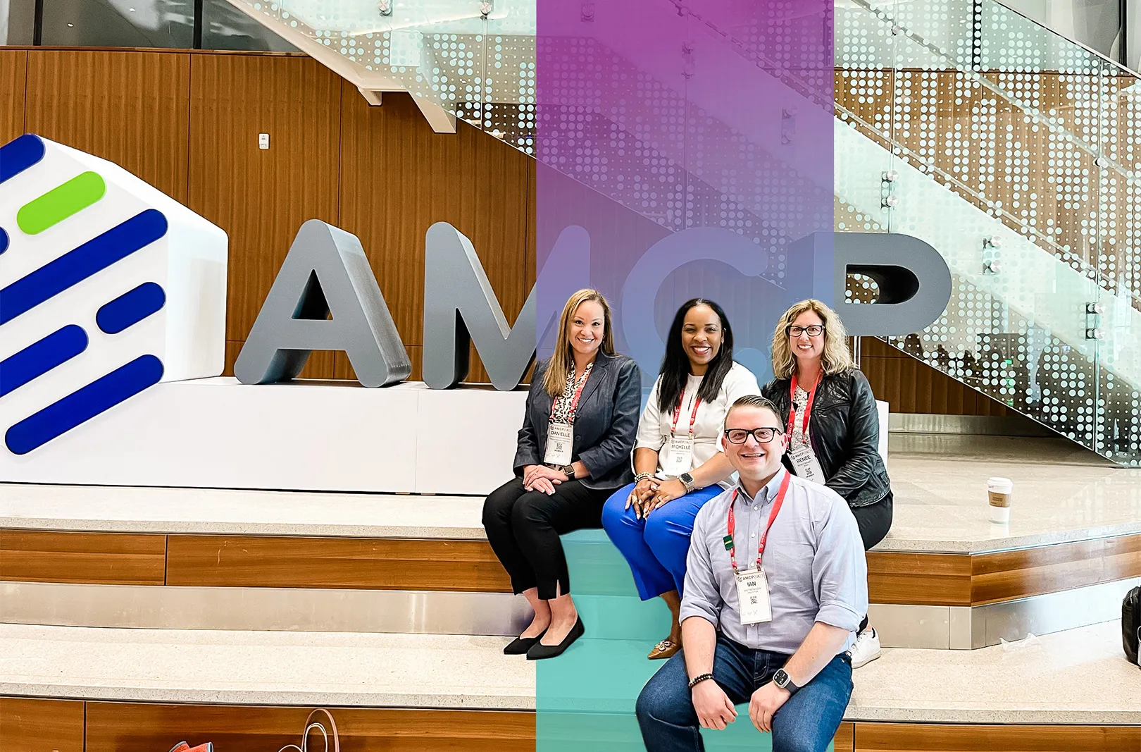 Group photo in front of AMCR sign